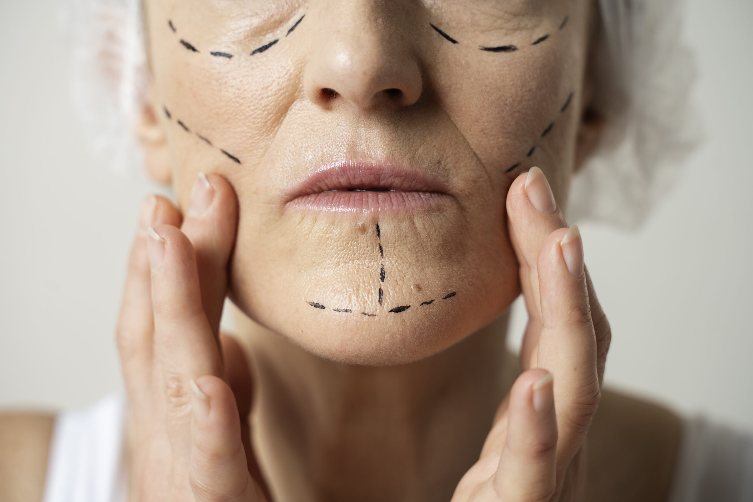 close-up-woman-with-marker-traces-face